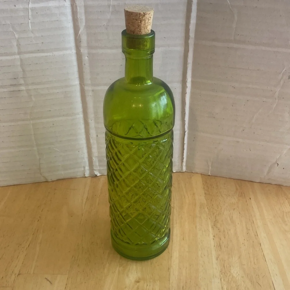 Beautiful green glass decorative or useful bottle. Made in Spain. NWOT.